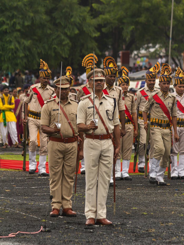Police officers in uniform marching during a ceremonial event in Sagar, India.
